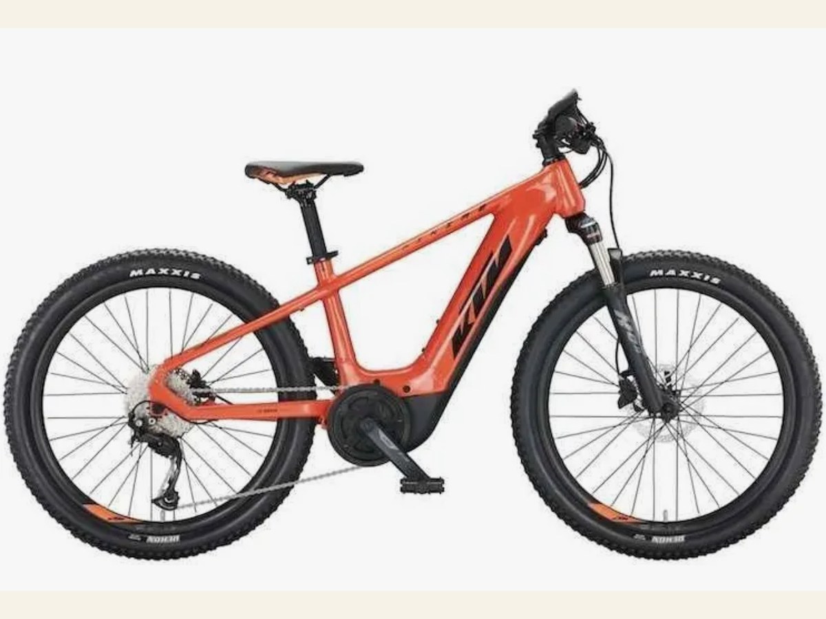 Orange KTM electric mountain bike for children, 24-inch category